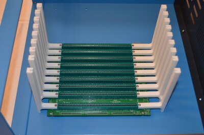 Backpanel and card cage assembly mounted in cabinet